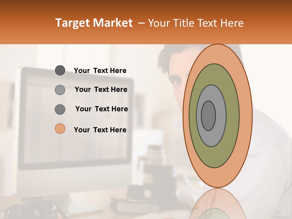 A Man Sitting At A Desk In Front Of A Computer PowerPoint Template
