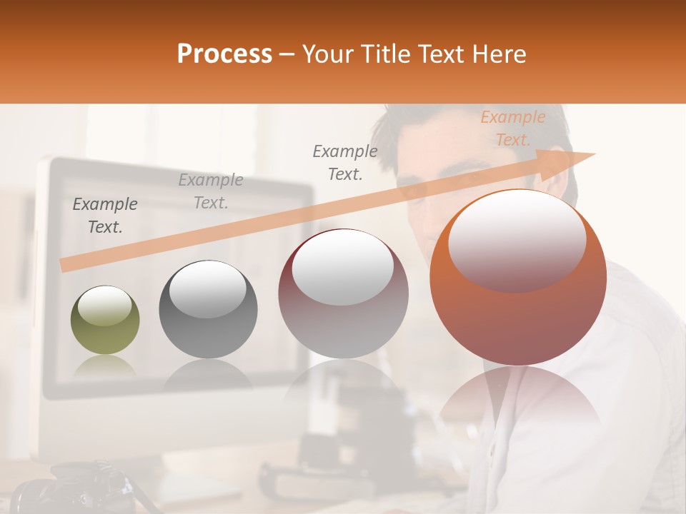 A Man Sitting At A Desk In Front Of A Computer PowerPoint Template