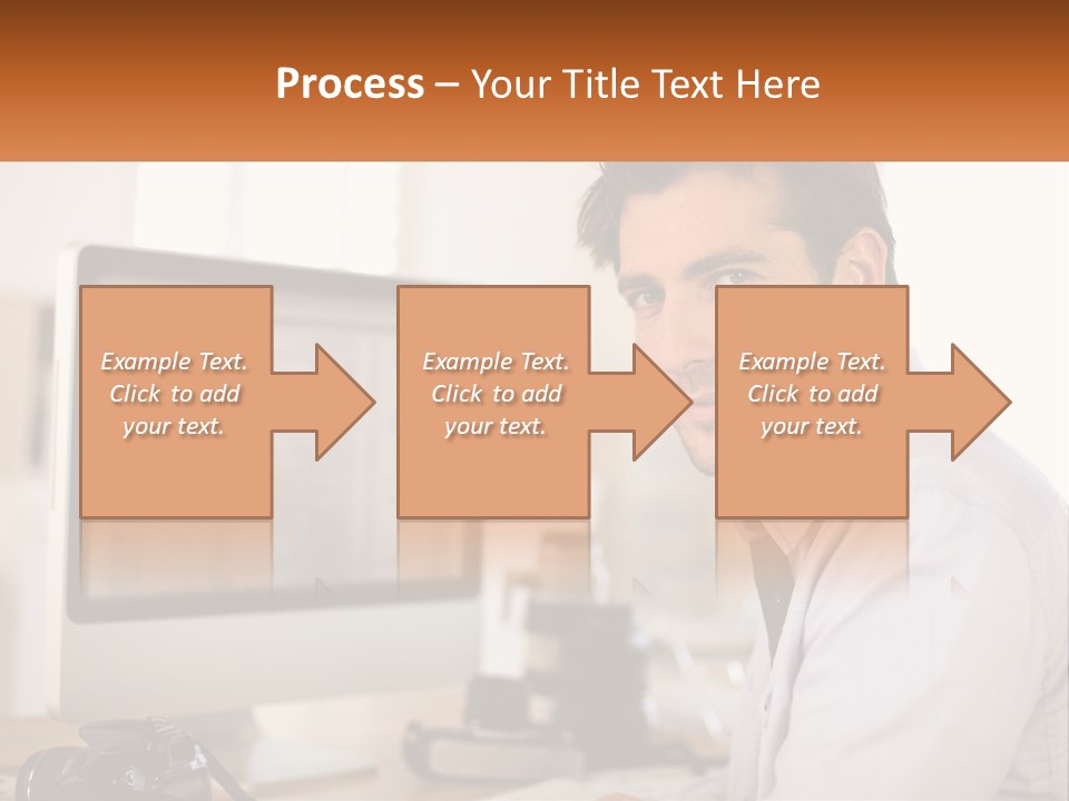 A Man Sitting At A Desk In Front Of A Computer PowerPoint Template