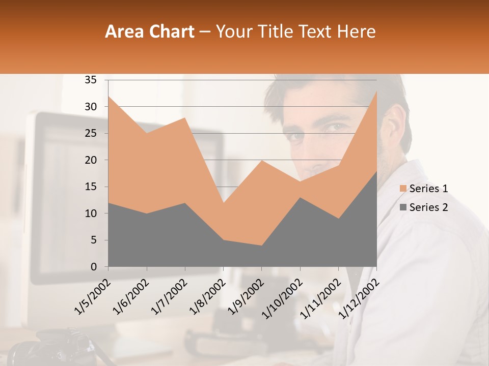 A Man Sitting At A Desk In Front Of A Computer PowerPoint Template