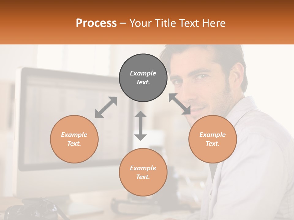 A Man Sitting At A Desk In Front Of A Computer PowerPoint Template