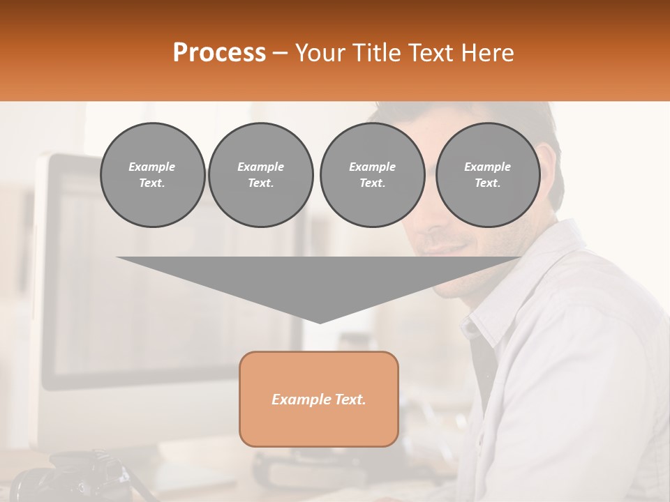 A Man Sitting At A Desk In Front Of A Computer PowerPoint Template