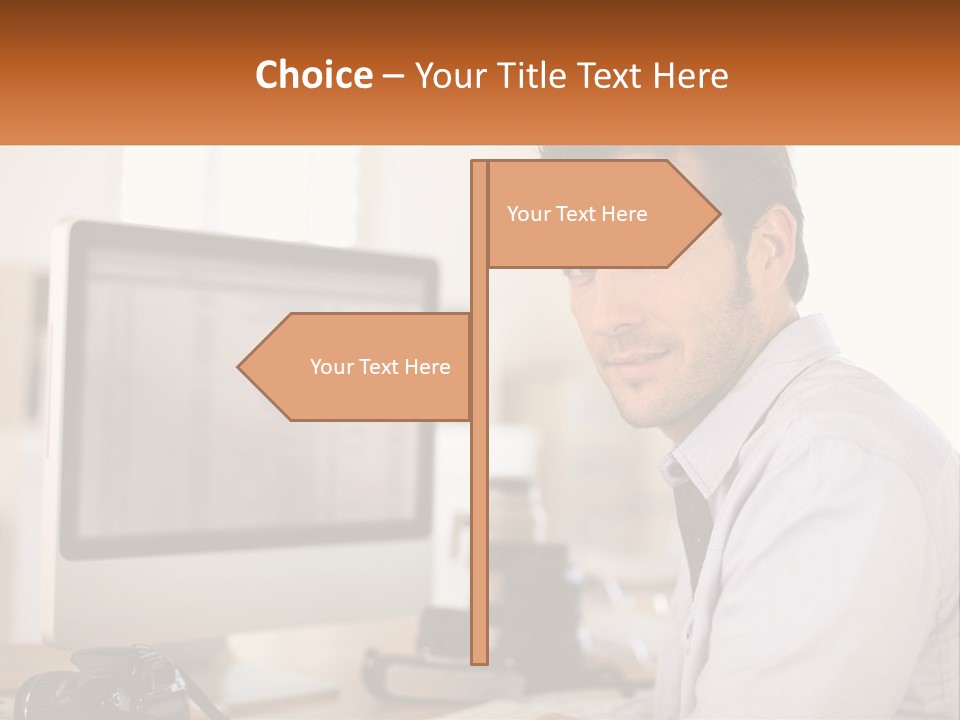 A Man Sitting At A Desk In Front Of A Computer PowerPoint Template