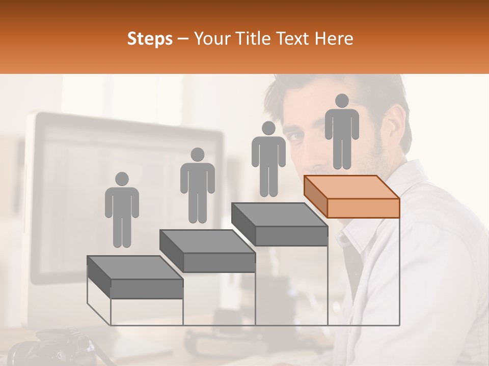 A Man Sitting At A Desk In Front Of A Computer PowerPoint Template