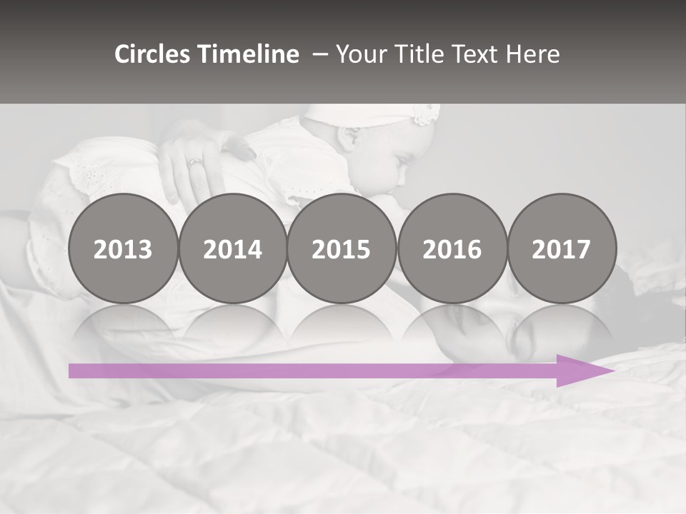 A Woman Laying On Top Of A Bed Holding A Baby PowerPoint Template