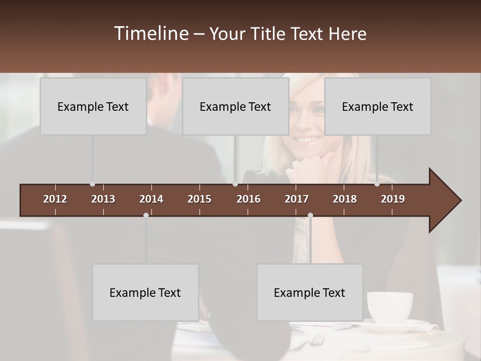 A Man And Woman Sitting At A Table Talking PowerPoint Template