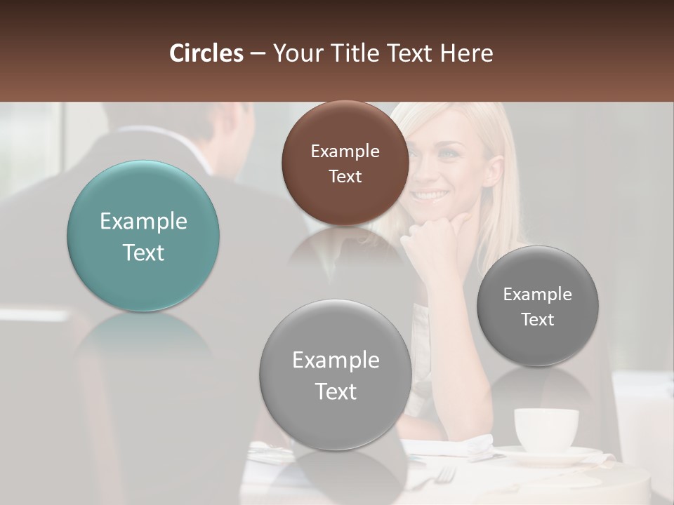 A Man And Woman Sitting At A Table Talking PowerPoint Template