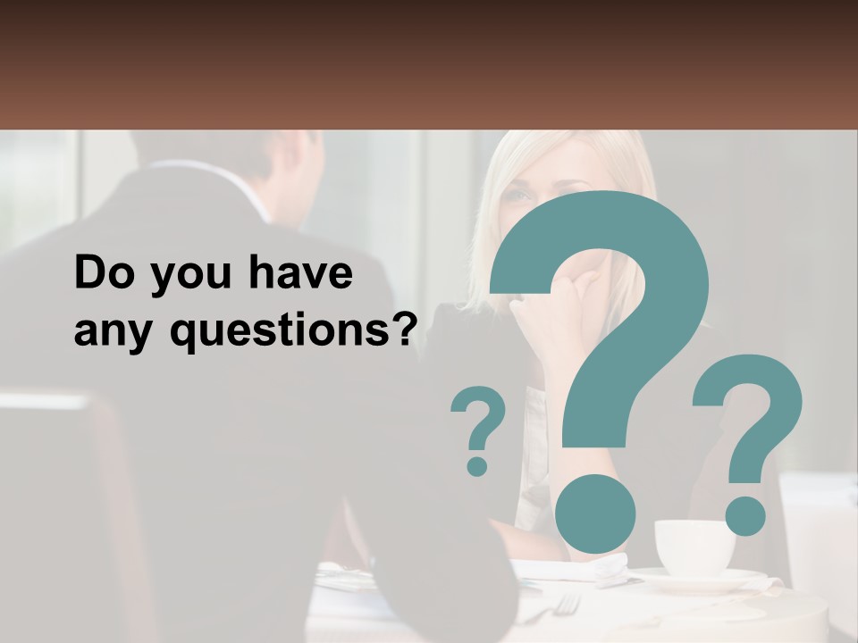 A Man And Woman Sitting At A Table Talking PowerPoint Template