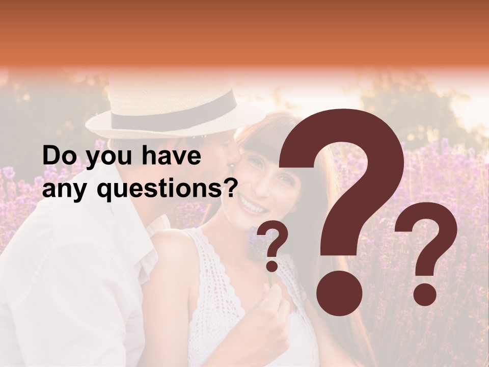 A Man Kissing A Woman In A Field Of Flowers PowerPoint Template