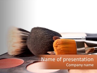 A Group Of Makeup Brushes Sitting On Top Of A Table PowerPoint Template