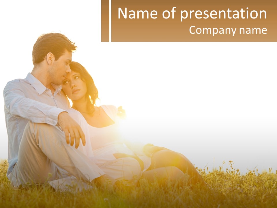 A Man And A Woman Sitting In The Grass PowerPoint Template
