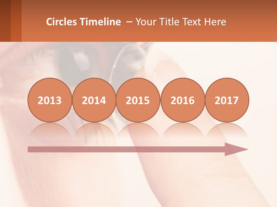 A Person Holding A Contact Lens Up To Their Eye PowerPoint Template