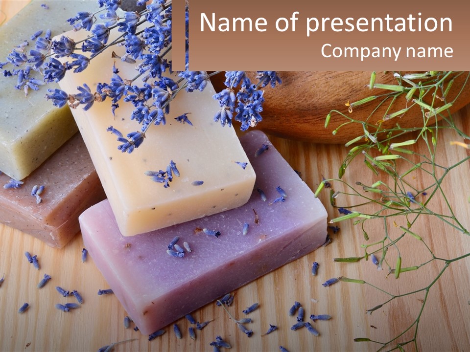 Soaps With Lavender Flowers On A Wooden Table PowerPoint Template