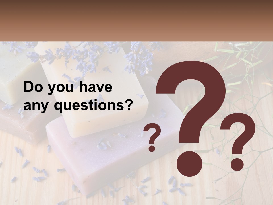 Soaps With Lavender Flowers On A Wooden Table PowerPoint Template