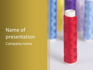 A Group Of Spools Of Thread Sitting On Top Of Each Other PowerPoint Template