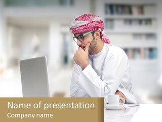 A Man Sitting In Front Of A Laptop Computer PowerPoint Template