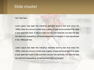 A Man Sitting In Front Of A Laptop Computer PowerPoint Template