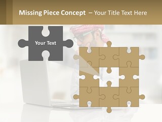 A Man Sitting In Front Of A Laptop Computer PowerPoint Template