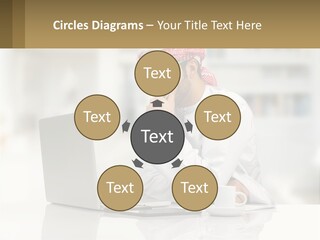 A Man Sitting In Front Of A Laptop Computer PowerPoint Template