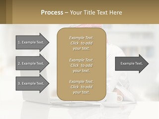 A Man Sitting In Front Of A Laptop Computer PowerPoint Template