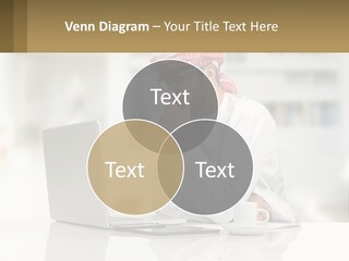 A Man Sitting In Front Of A Laptop Computer PowerPoint Template