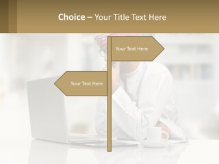 A Man Sitting In Front Of A Laptop Computer PowerPoint Template