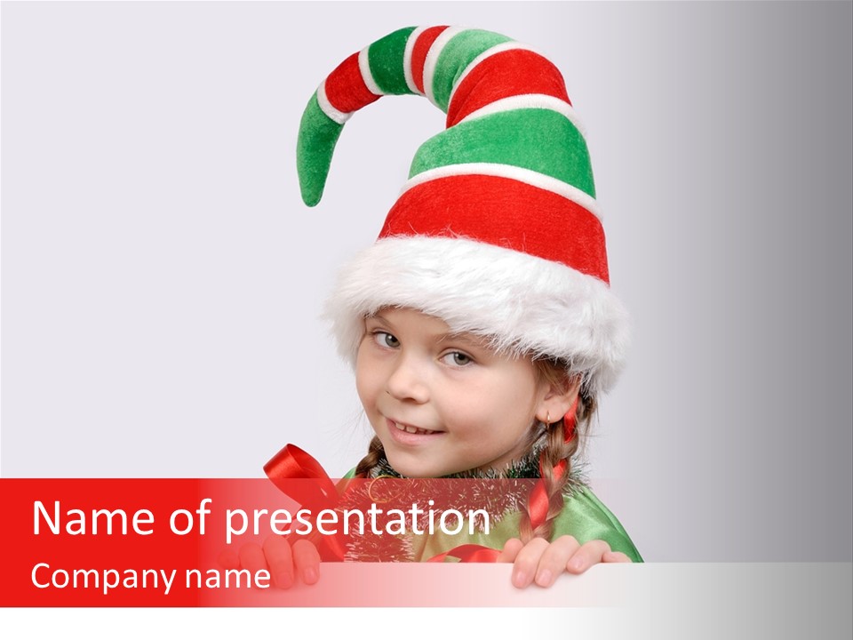 A Little Girl Wearing A Santa Hat And Holding A Present PowerPoint Template