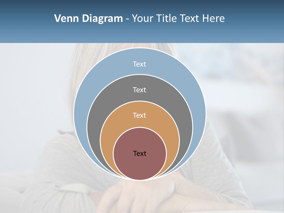 A Woman Sitting On A Couch Smiling For The Camera PowerPoint Template