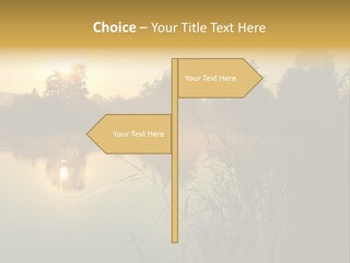 The Sun Is Setting Over A Lake With Reeds In The Foreground PowerPoint Template