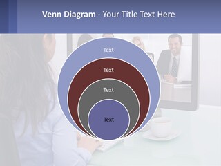 A Woman Looking At A Computer Screen With A Group Of People On It PowerPoint Template