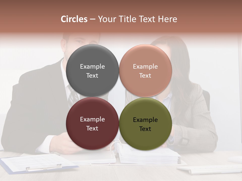 A Man And A Woman Sitting At A Desk PowerPoint Template