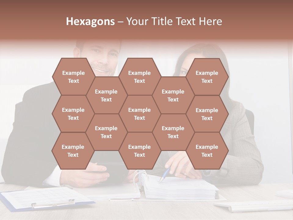 A Man And A Woman Sitting At A Desk PowerPoint Template