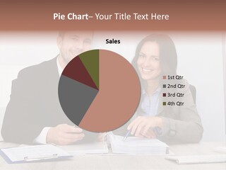 A Man And A Woman Sitting At A Desk PowerPoint Template