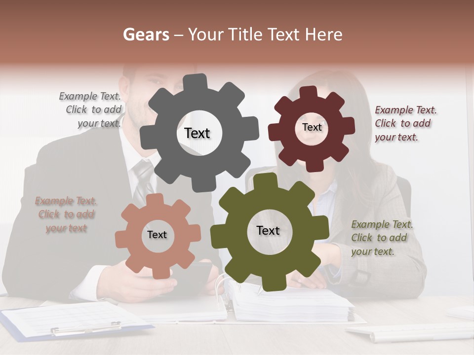 A Man And A Woman Sitting At A Desk PowerPoint Template