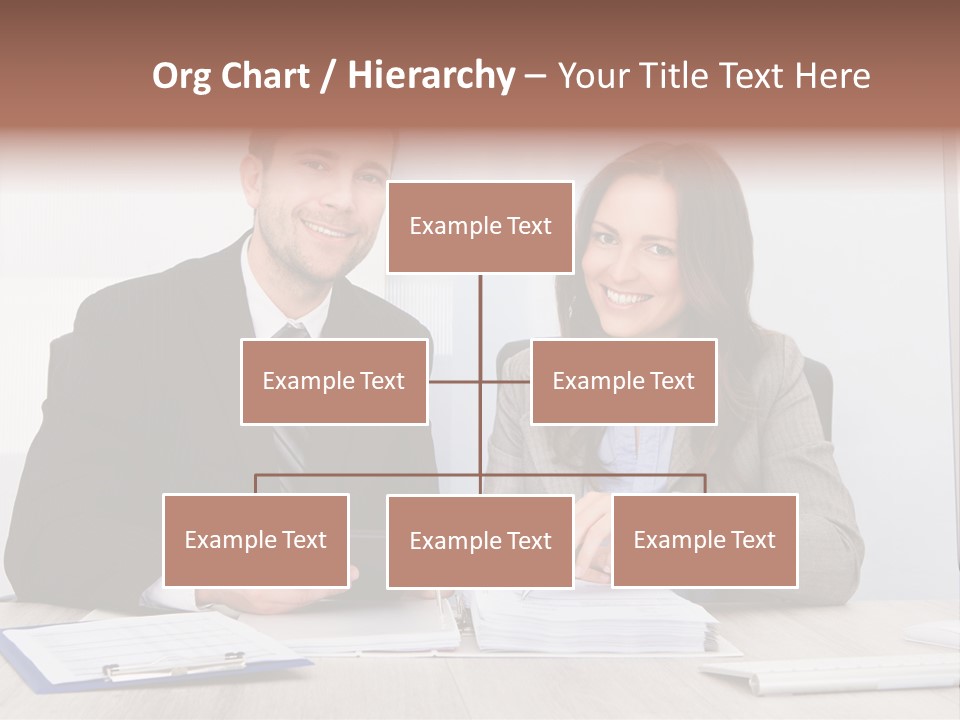 A Man And A Woman Sitting At A Desk PowerPoint Template