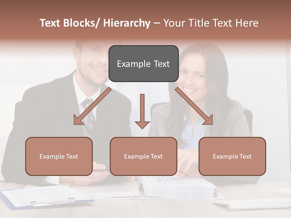 A Man And A Woman Sitting At A Desk PowerPoint Template