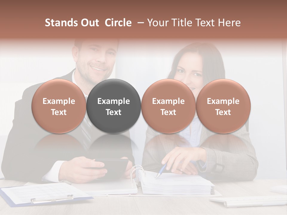 A Man And A Woman Sitting At A Desk PowerPoint Template