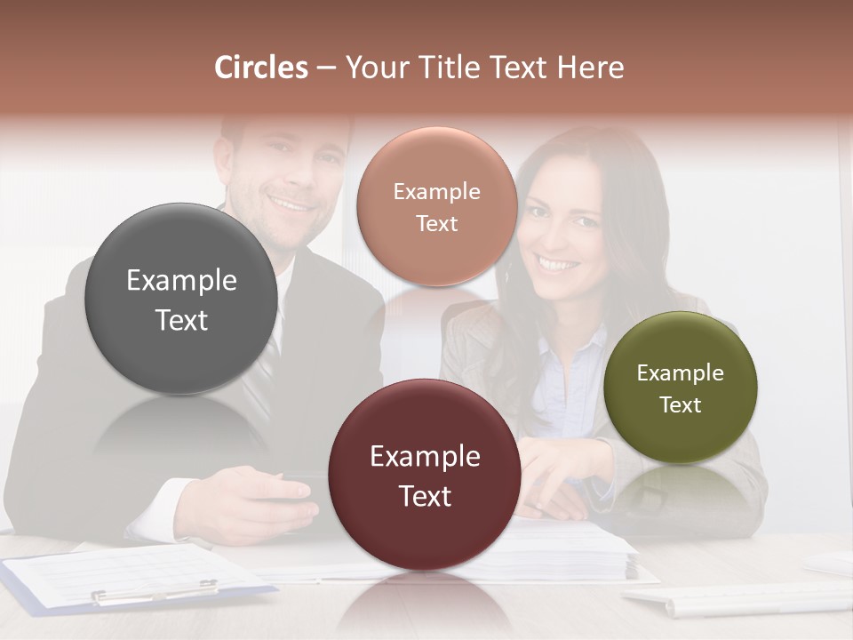 A Man And A Woman Sitting At A Desk PowerPoint Template