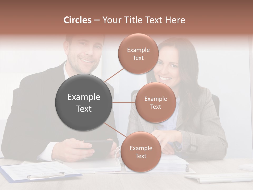 A Man And A Woman Sitting At A Desk PowerPoint Template