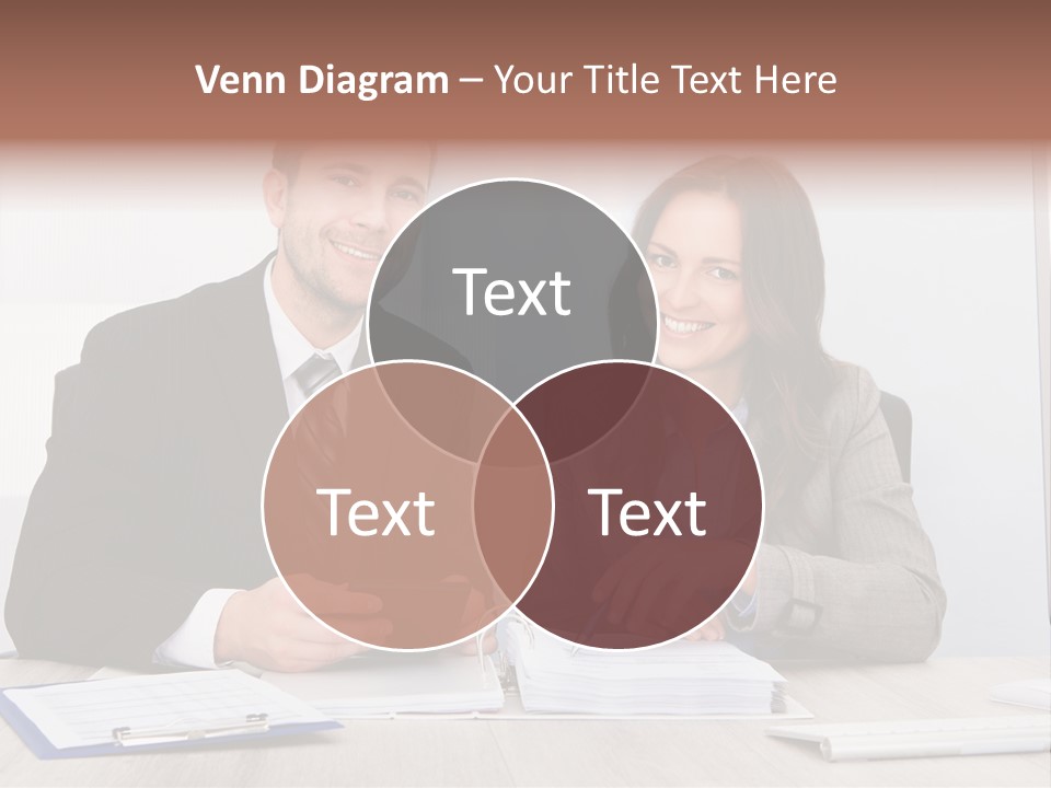 A Man And A Woman Sitting At A Desk PowerPoint Template