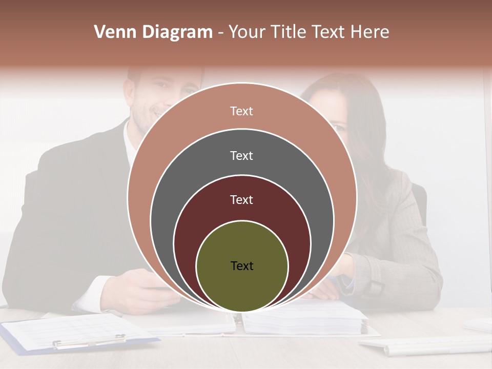 A Man And A Woman Sitting At A Desk PowerPoint Template