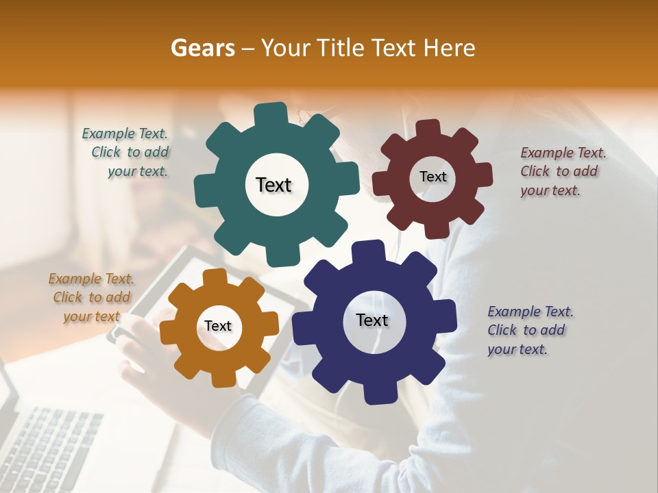 A Man Sitting In Front Of A Laptop Computer PowerPoint Template
