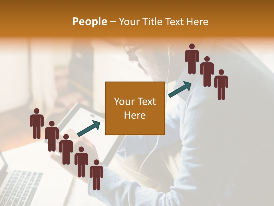 A Man Sitting In Front Of A Laptop Computer PowerPoint Template