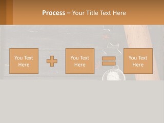 A Wooden Table Topped With A Cookie Cutter And Star Anise PowerPoint Template