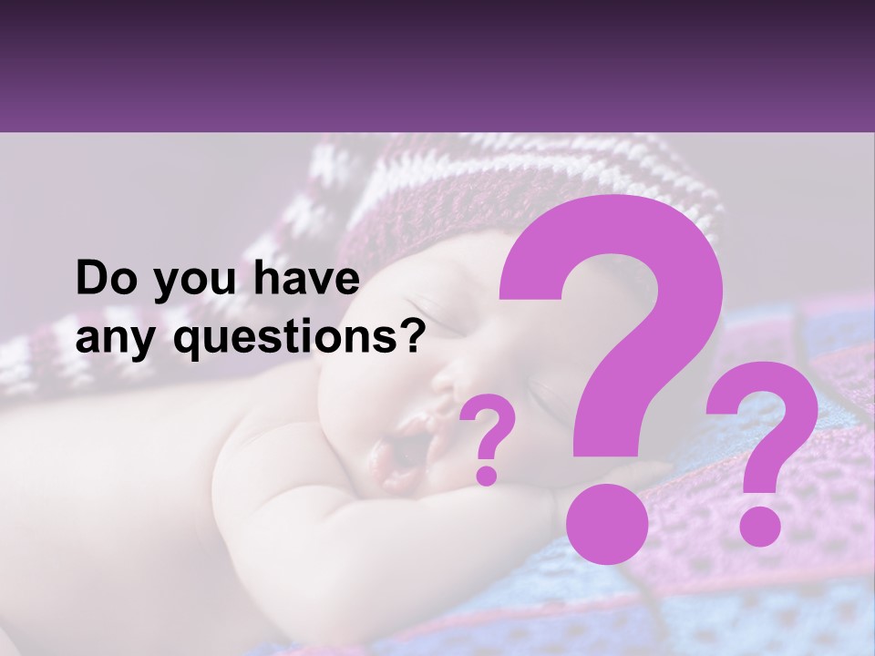 A Baby Wearing A Knitted Hat Laying On A Blanket PowerPoint Template