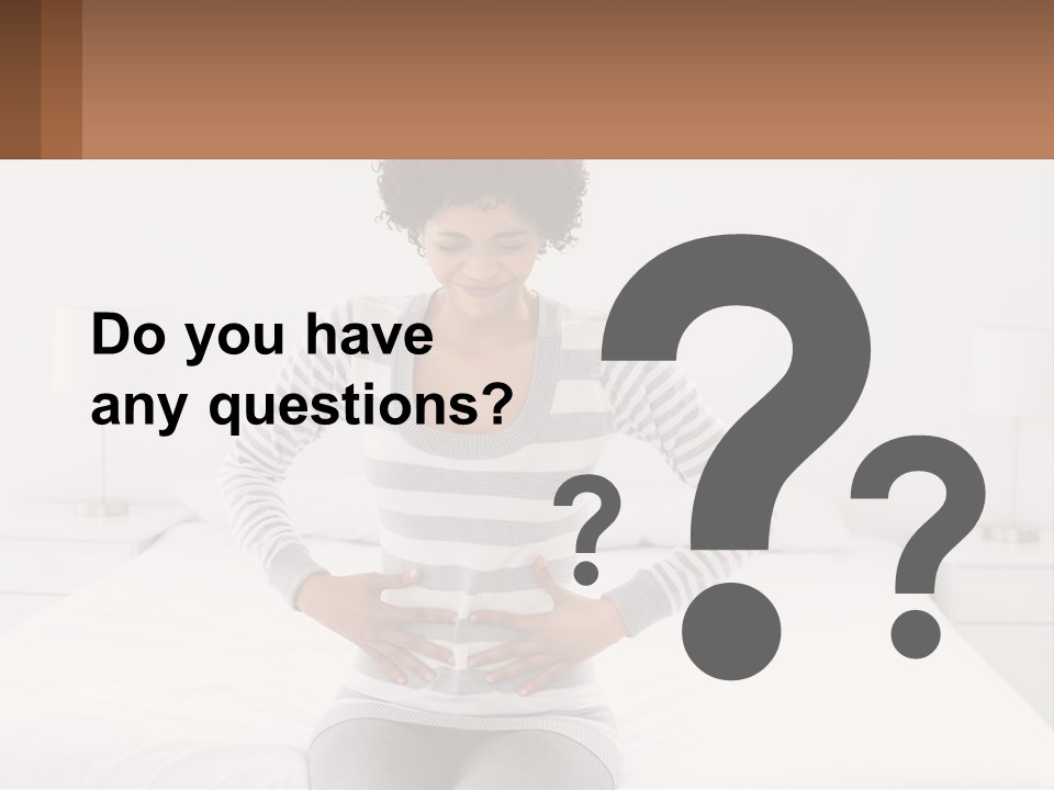 A Woman Standing On A Bed Holding Her Stomach PowerPoint Template