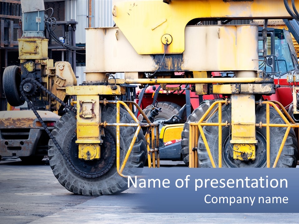 A Large Yellow Machine Is Parked In Front Of A Building PowerPoint Template