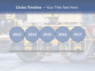 A Large Yellow Machine Is Parked In Front Of A Building PowerPoint Template