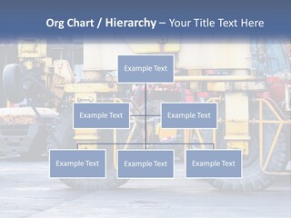 A Large Yellow Machine Is Parked In Front Of A Building PowerPoint Template