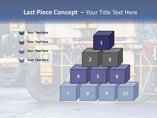 A Large Yellow Machine Is Parked In Front Of A Building PowerPoint Template